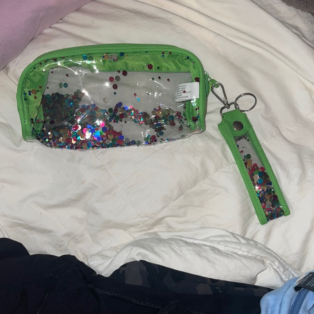 Clear green makeup/pen & pencil holder come with the wristlet attached